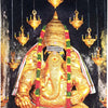Pillaiyar Patti Photo, a gold-toned, seated sculpture with eight hanging lamps and two red-and-green floral garlands on a dark, speckled background