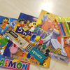 Colouring Book Set - No - 7, four colourful colouring books, one pencil box, six paint pots, and sixteen coloured pens displayed on a light surface