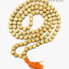 Tulasi Mala / Tulsi Mala, a looped strand of numerous pale brown round beads threaded on orange string, ending with an orange tassel
