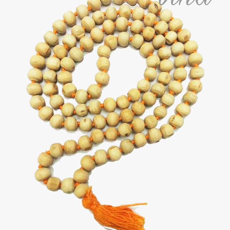 Tulasi Mala / Tulsi Mala, a looped strand of numerous pale brown round beads threaded on orange string, ending with an orange tassel