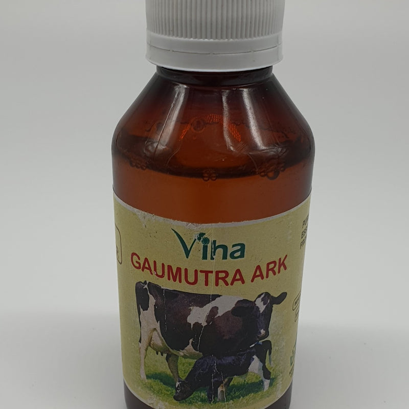 Viha's Goumutra, an amber plastic bottle with a ribbed white cap and a rectangular label