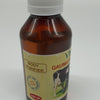 Viha's Goumutra / Pasu Komiyam, a brown plastic bottle with a ribbed white cap, bearing a beige label featuring black and red text and a cow image