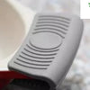 Silicon Heat Resistant Anti-Slip Pot Bowl Holder Clips, a grey ribbed handle cover attached to a pan