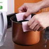 Silicon Heat Resistant Anti-Slip Pot Bowl Holder Clips, hands gripping two pink grips on a brown pot
