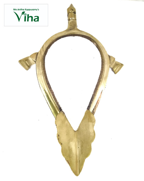Shankh Stand, brass teardrop-shaped ring stand with a pointed finial above, two small side cups and a broad leaf-shaped foot