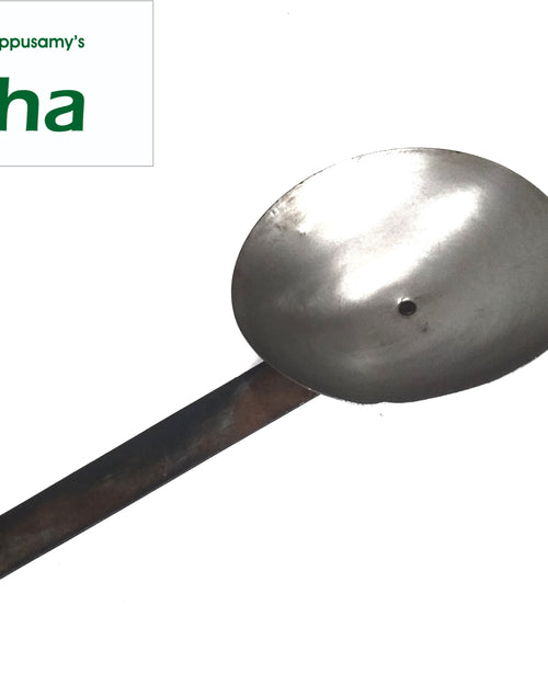 Iron Spoon - Big, a dark grey metallic utensil with a round, shallow, bowl featuring one central hole and an angled, flat, rectangular handle