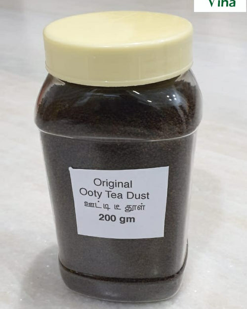 Ooty Premium Organic Black Tea in a translucent plastic jar with dark contents