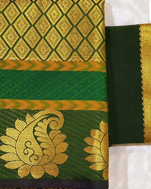 Unstitched Pattu Pavadai Set 5-8 years (Lehenga Set), a dark green folded textile featuring gold-toned patterned borders and large paisley motifs