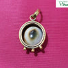 Gomathi Chakra Designer Brass Pendant, a gold-toned pendant featuring a round, white, and brown patterned stone set within a metallic rim