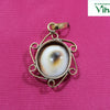 Gomathi Chakra Pendant, Scroll Sides, gomathi chakra in a round bezel with S-curl scrollwork at each side