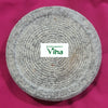 Turmeric Rubbing Stone, a grey textured circular flat stone object featuring multiple concentric grooved circular lines across its surface