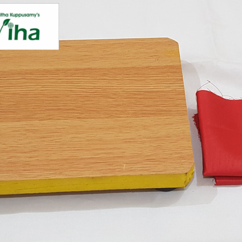 Manai With Red Cloth, a rectangular wooden-patterned board with yellow edges and a folded red fabric piece beside it