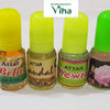Athar-Sandal, Kewra, Rose, Jasmine Set Of 4, four small glass bottles with glossy coloured caps and labels sit side-by-side on a white surface