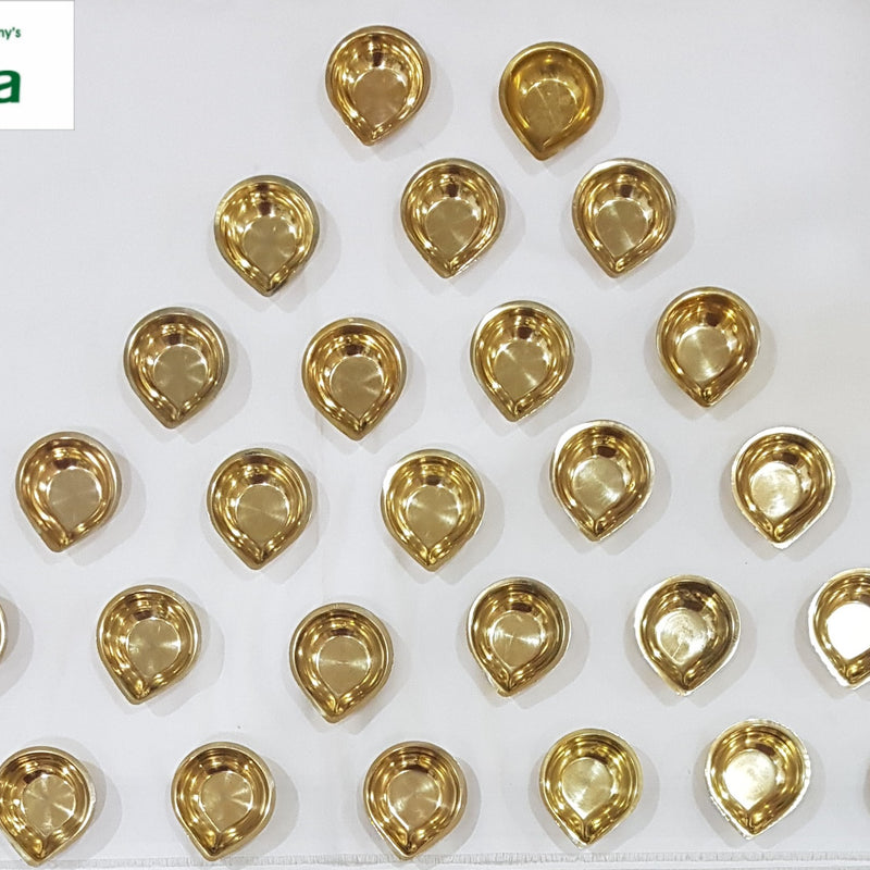 Set of 27 brass karthigai vilakku, small teardrop agal lamps arranged in rows