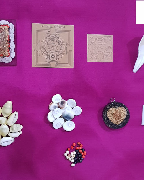 Main Entrance Vastu Set With Original Navarathna Stones, seven items including shells, square cards, a pyramid, and beads on a magenta cloth