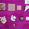 Main Entrance Vastu Set With Original Navarathna Stones, seven items including shells, square cards, a pyramid, and beads on a magenta cloth