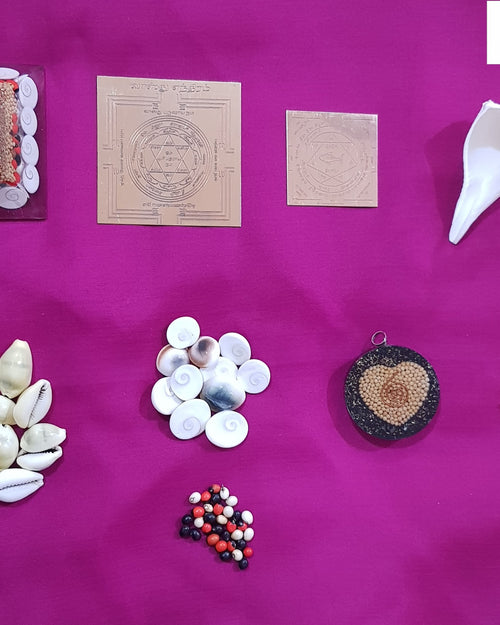 Main Entrance Vastu With Synthetic Navarathna Stones, a pink cloth holding a square pyramid, two square plates, a conch shell, twenty shells