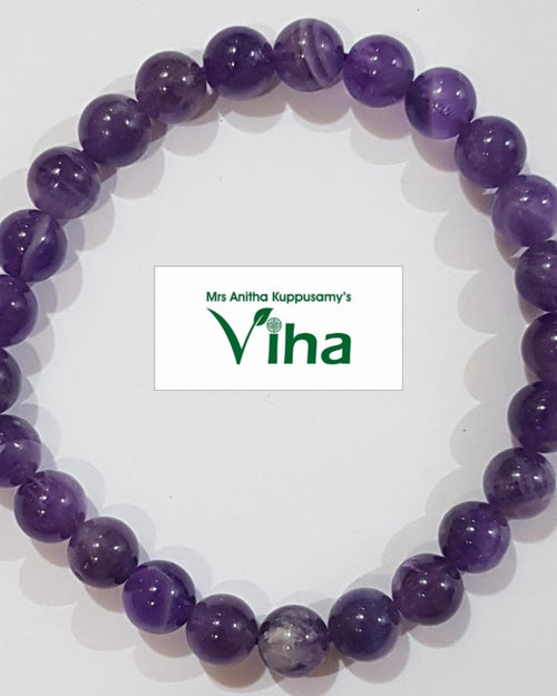 Amethyst Bracelet, bracelet of purple beads with one paler banded bead among them