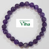 Amethyst Bracelet, bracelet of purple beads with one paler banded bead among them
