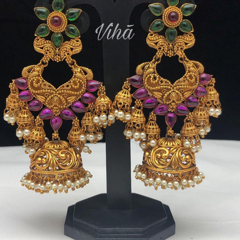 Jhumkas, drop earrings with hanging bells and floral elements
