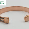 Copper Bracelet With Magnet, a copper-coloured metallic open cuff bracelet with braided inlay detail and smooth, rectangular ends