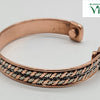 Copper Bracelet With Magnet, a copper-coloured cuff bracelet with two interwoven rows of twisted copper and silver-toned metal strands