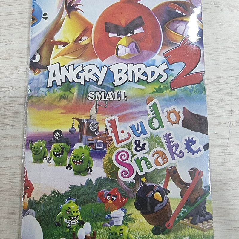 Angry Birds Snake & Ludo 1 Game, a vertical, glossy game packaging featuring cartoon illustrations of Angry Birds and green pigs in various poses and sizes