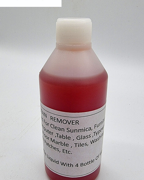Stain Remover (Herbal), a translucent red plastic bottle filled with red liquid, featuring a white ribbed cap and a rectangular white label with black text