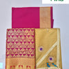 Apoorva Silk Half Saree Set, a magenta and a gold-toned fabric piece, one patterned with repeating gold-toned motifs and one adorned with two floral appliqués