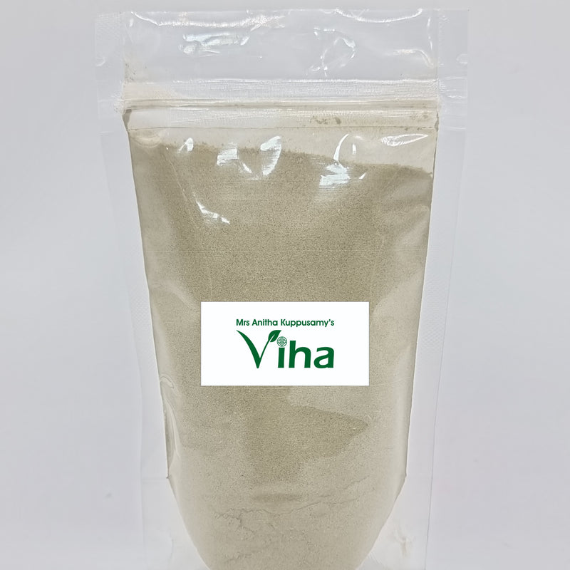 Amman Pacharisi Powder, a clear plastic pouch containing light-grey powder with one rectangular white label in the centre