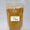 Poosu Manjal Powder, a clear plastic zip-top pouch containing yellow-brown powder features a central white rectangular label with green text