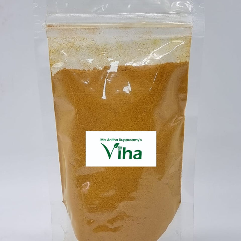 Poosu Manjal Powder, a clear plastic zip-top pouch containing yellow-brown powder features a central white rectangular label with green text
