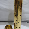 Agarbathi Stand (Brass), a gold-toned metallic cylinder with star cutouts and a dome-shaped lid, beside a matching circular base with a holder component