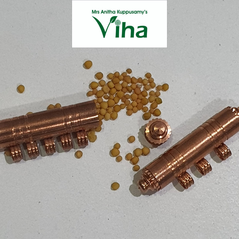 Venkadugu Thayathu, two copper capsule amulets with ribbed bands and scattered mustard seeds