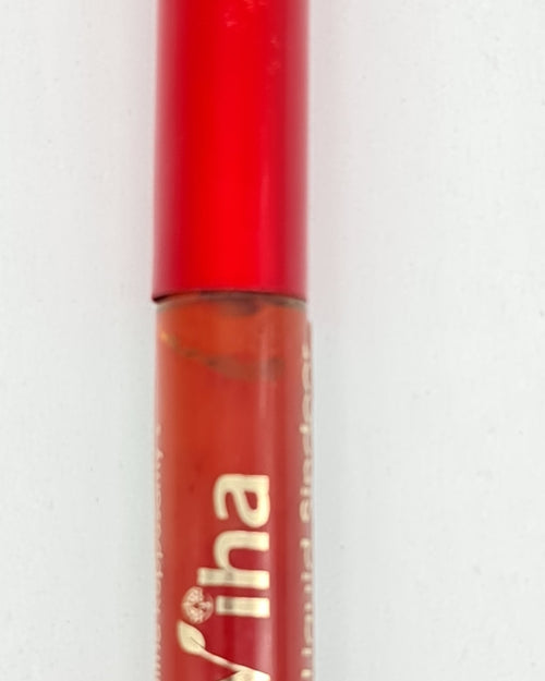 Red Liquid Sindoor, a round red container featuring a cap, translucent body, and gold-toned lettering with a leaf motif