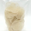 Omam / Ajwain fryums in a transparent plastic bag containing small white discs