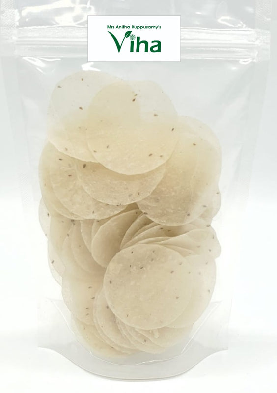 Omam / Ajwain fryums in a transparent plastic bag containing small white discs