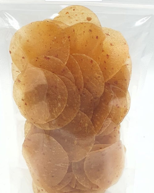 Red chilli fryums in a thin translucent plastic bag