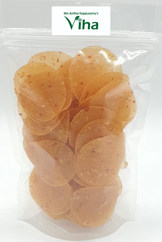 Tomato Chilli fryums, in a transparent plastic bag
