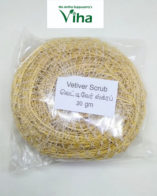 Vetiver Scrub / Vettiver, one round yellow-brown fibrous textured pad wrapped inside clear transparent plastic with a white rectangular text label attached