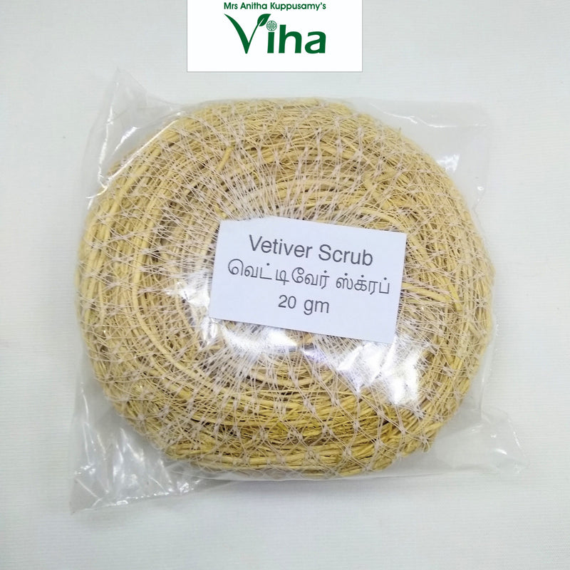 Vetiver Scrub / Vettiver, one round yellow-brown fibrous textured pad wrapped inside clear transparent plastic with a white rectangular text label attached