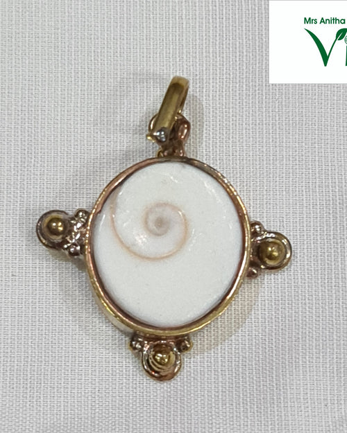 Gomathi Chakra Brass Pendant, a brass frame holding a Gomathi Chakra (spiral shell)