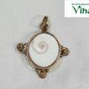 Gomathi Chakra Brass Pendant, a brass frame holding a Gomathi Chakra (spiral shell)