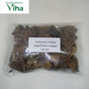 Brinjal Fryums with dark dried pieces in a transparent pouch