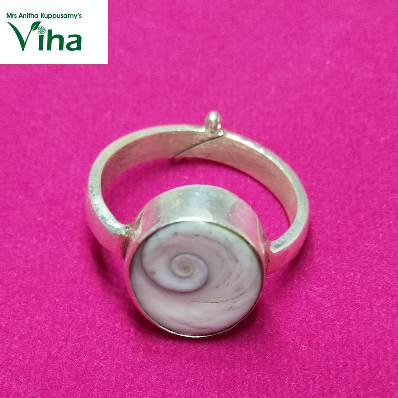 Silver Gomathi Chakra Ring, a silver-toned adjustable ring featuring a round white stone with a grey spiral pattern