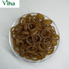 Onion Ring Fryums, a clear glass bowl filled with numerous small, brownish-yellow, ring-shaped dried food items featuring a smooth surface finish