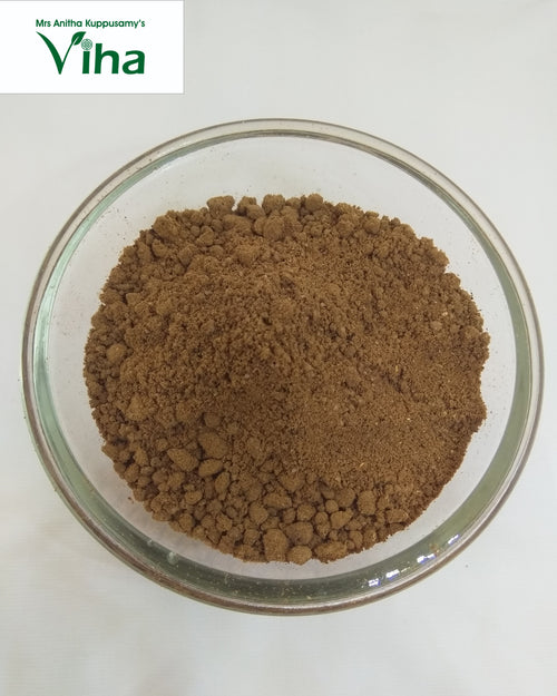 Soapnut Powder / Boondhi Kottai Powder, brown powder in a clear glass bowl against a white background