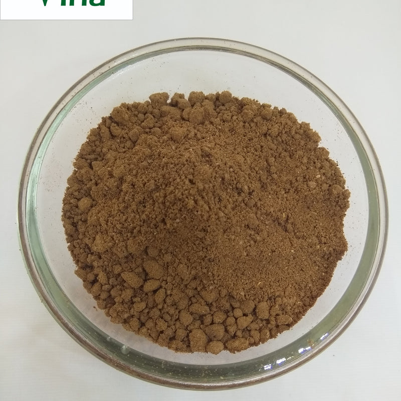Soapnut Powder / Boondhi Kottai Powder, brown powder in a clear glass bowl against a white background