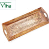 Wooden Tray, a rectangular brown wooden tray features curved handles and an inlaid pattern of pierced lattices and six light-colored leaf shapes