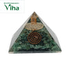 Green Aventurine Pyramid, a clear pyramid encasing green chips, a copper-toned spiral, and a golden geometric disc with a vertical coil